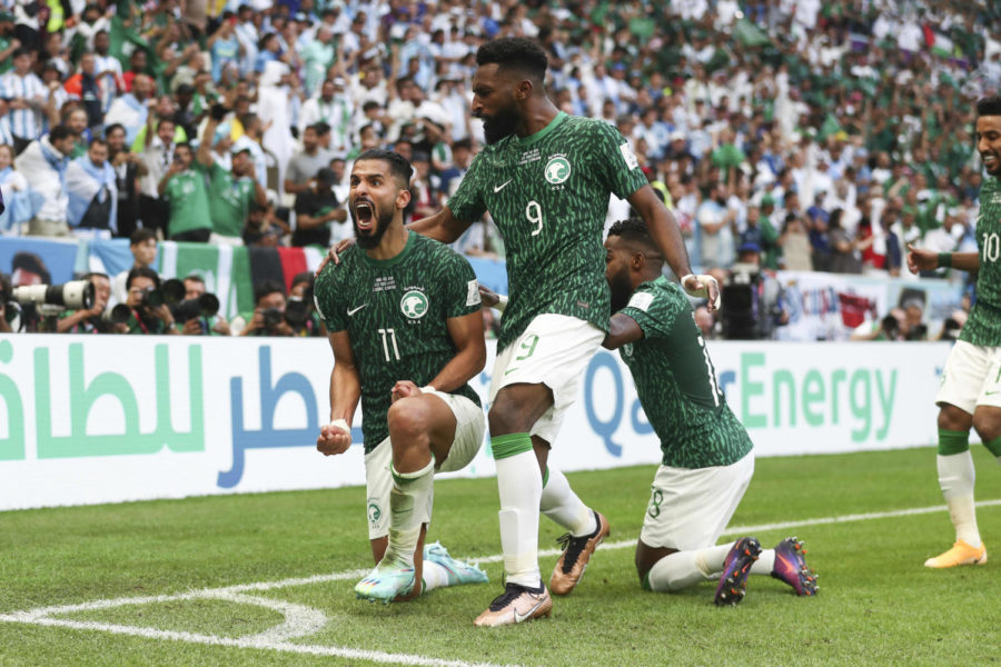 Saudi Arabian players Saleh Al-Shehri and Feras Al-Brikan Feras celebrate their first goal against Argentina.
