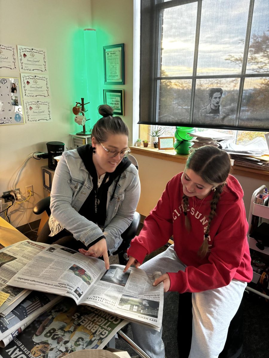 Ms Campbell and Julia Coco (11) discussing articles. Image credit to Sofia Leache.