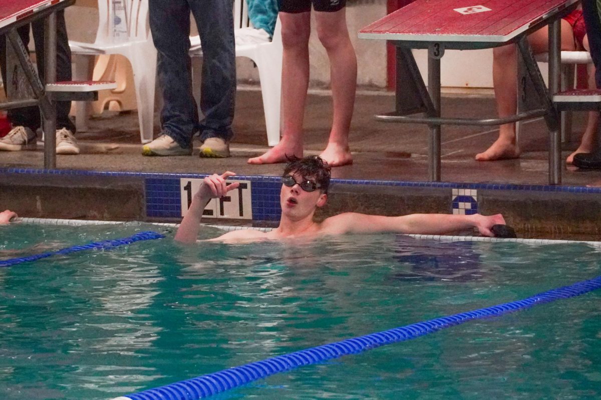 Nash Bayne captured after claiming first in the 100 fly.